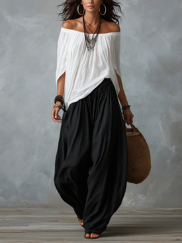 Set Top Bianco Off-Shoulder e Pantaloni Larghi
